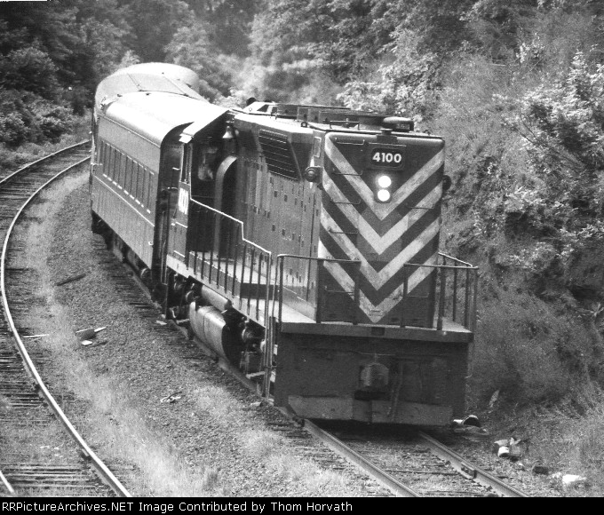 In an undated scene, NJT 4100 and 3 coaches round the bend
